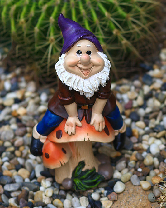 Joyful Gnome Sitting on a Mushroom Garden Statue