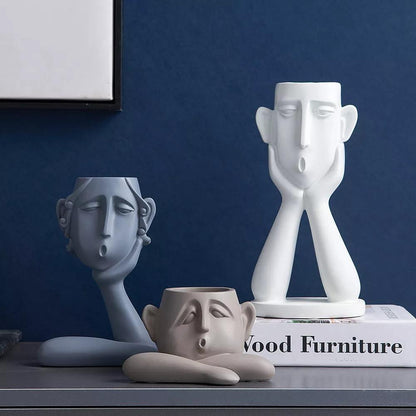 Trio de sculptures de pots de fleurs visages émotionnels